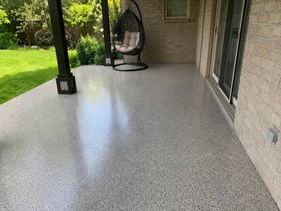 Covered back patio finished in a grey flake coating