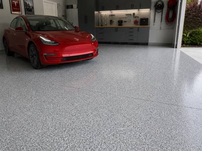 Vehicle parked on a finished grey flake floor