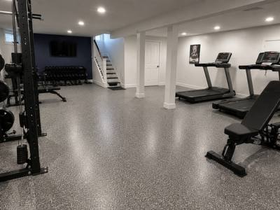Grey flake floor across a finished basement home gym