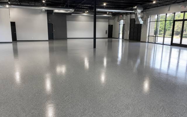 Open commercial unit finished in a grey flake epoxy system